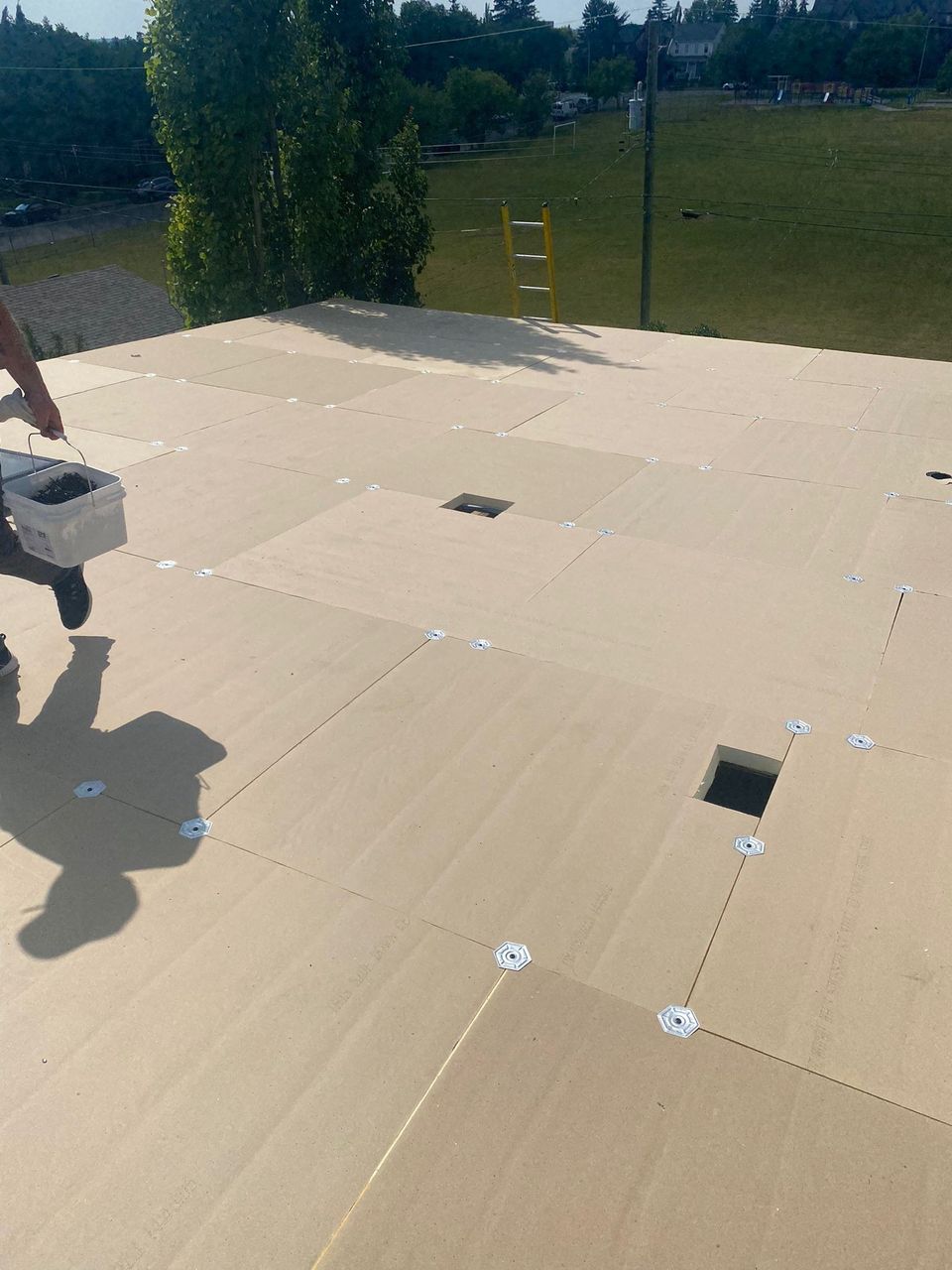 Flat roof coverboard with cut-outs for a roof drain and vents
