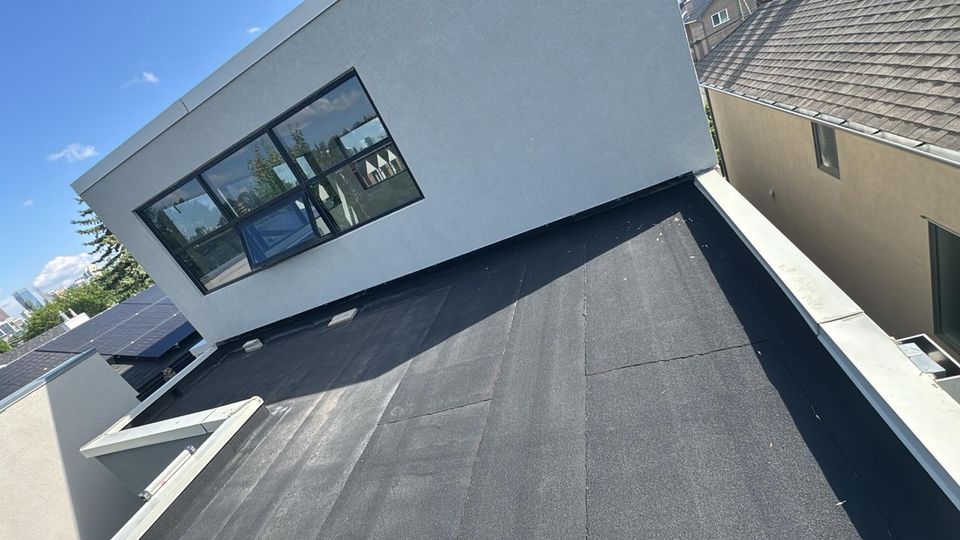 Granulated SBS flat roof on a modern infill home with downtown Calgary in the distance